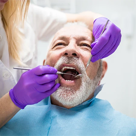 Dentist Performing Dental Care On Patient Kombu 2 HP